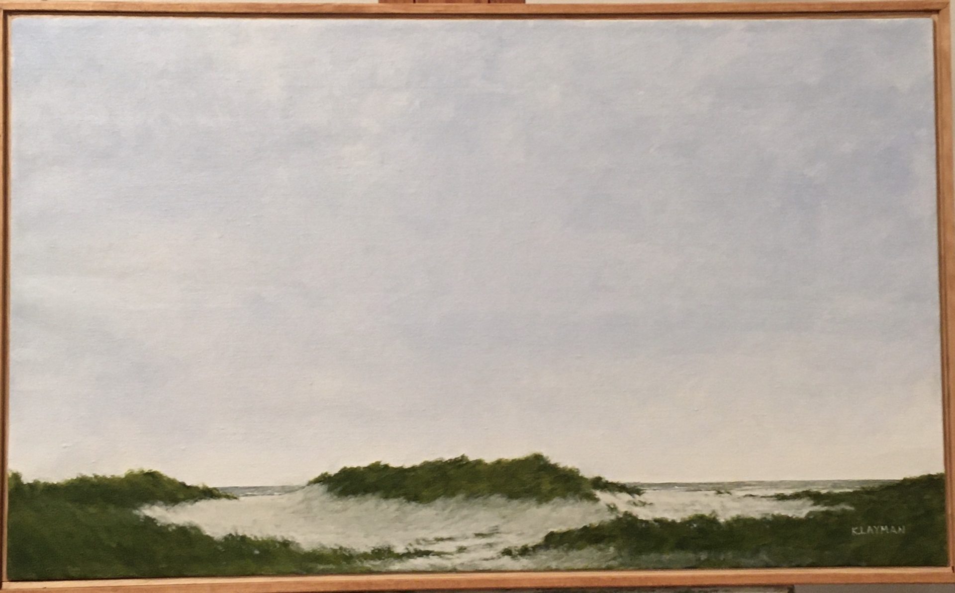 Painting Of A Gray Sky And Shore With Sand And Grass Hills